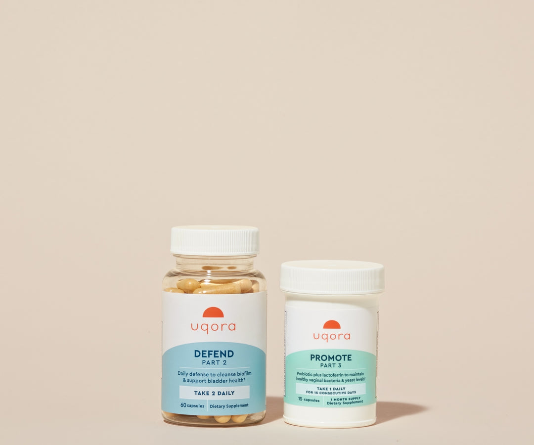 A clear plastic jar with pills and a 'Uqora Defend' label, and a plastic pill bottle with a 'Uqora Promote' label
