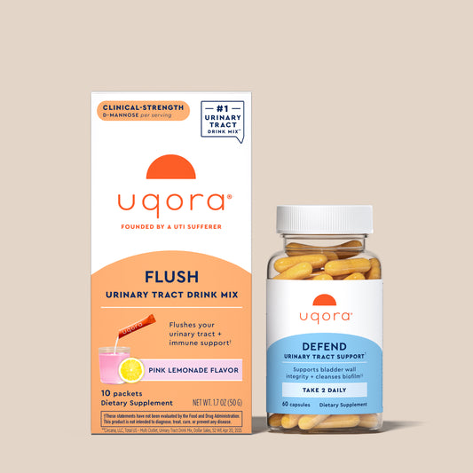 Uqora Pink Lemonade Flush box and Defend bottle on tan background