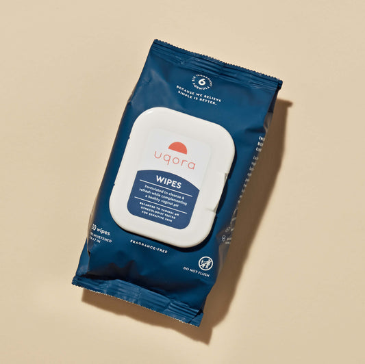 A sealed bag with a 'Uqora Wipes' label and a little lid as dispenser