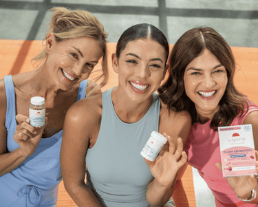 Three smiling women holding Uqora products